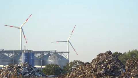 Eco power. Wind turbines generating electricity and rubbish landfill Stock Footage 92998885