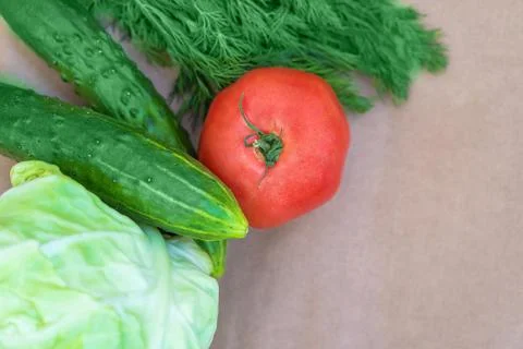 Eco-vegetables on a paper background close-up with a copy space.  Stock Photos