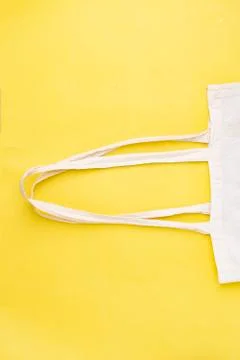 Eco white textile bag, zero waste. Top view, vertical composition Stock Photos