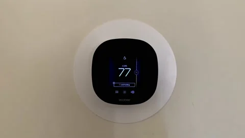 Ecobee smart thermostat installed on the wall of home. Front view. Smart Stock Footage 151710771