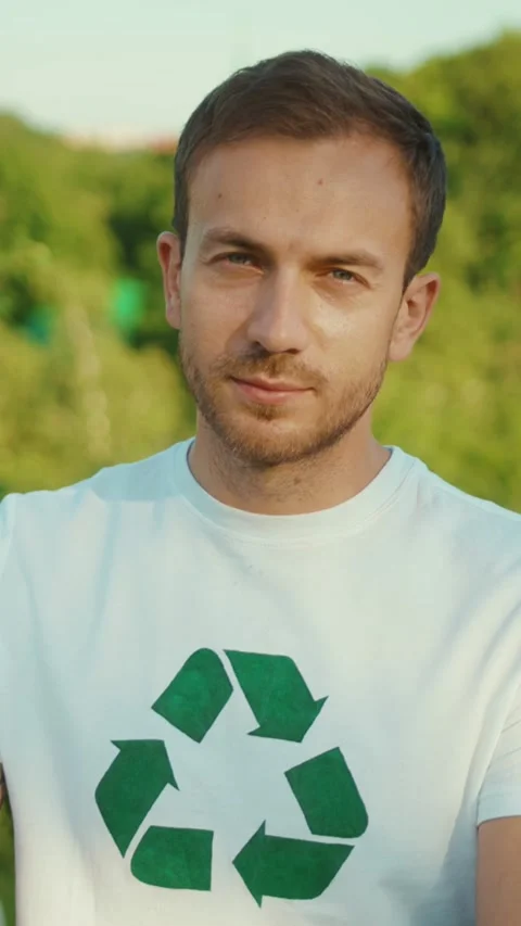 An Ecoconscious Young Man Actively Engaging in Promoting Recycling and Stock Footage 316539011