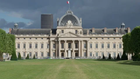 Ecole Militaire building facade with green lawn under stormy sky in Paris Stock Footage 337294518