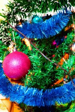 Ecologic Christmas tree made from gift boxes and rustic Christmas decorations on Stock Photos