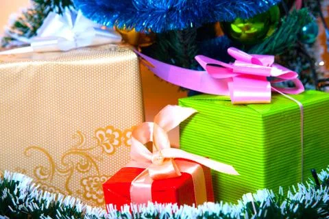 Ecologic Christmas tree made from gift boxes and rustic Christmas decorations on Stock Photos