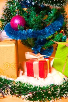 Ecologic Christmas tree made from gift boxes and rustic Christmas decorations on Stock Photos