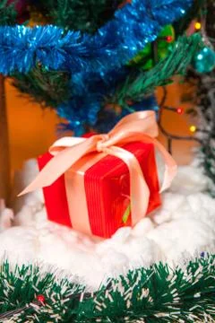Ecologic Christmas tree made from gift boxes and rustic Christmas decorations on Stock Photos