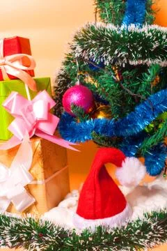 Ecologic Christmas tree made from gift boxes and rustic Christmas decorations on Stock Photos