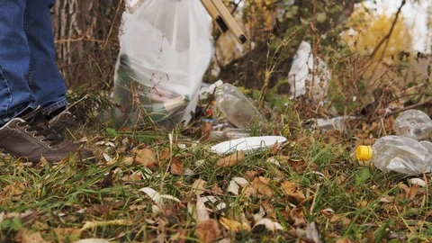 Ecological concept, collection of plastic trash on the nature. Responsible male Stock Footage 120871356