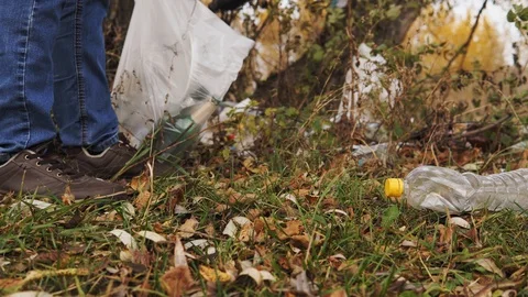 Ecological concept, collection of plastic trash on the nature. Responsible male Stock Footage 120871549