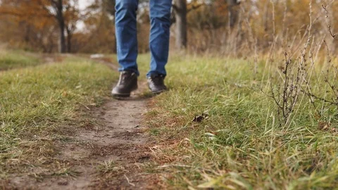 Ecological concept plastic pollution. An irresponsible man in blue jeans throws Stock Footage 120872994