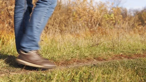 Ecological concept plastic pollution. An irresponsible man in blue jeans throws Stock Footage 120873083