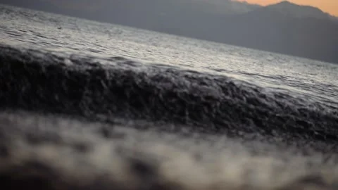 An ecological disaster waves dark water throws out garbage. Droplet splashing Stock Footage 147939196