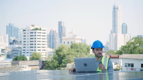 Ecological engineer using laptop and inspect about solar panels on roof top. Stock Footage 151518831