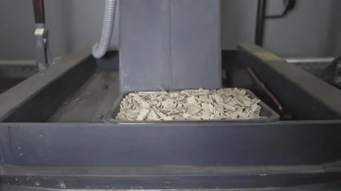Ecological heating with wood chips, 4K slow motion Stock Footage 270808310