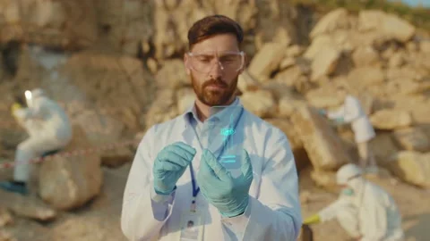 Ecological Scientist Using Holographic Phone Exploring Virtual Models of Wind Stock Footage 137821855