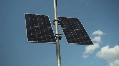 Ecological solar panel on a pole. Green energy comes from the sun's rays. Stock Footage 208807449