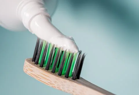 Ecological toothbrush with biodegradable bristles with toothpaste on top. Stock Photos