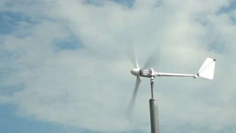 An ecological wind generator in the form of a propeller is spinning. A propeller Stock-Footage 208807440