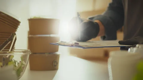 Ecologically pure. A warehouse worker dressed in protective clothing concent Stock Footage 266806734