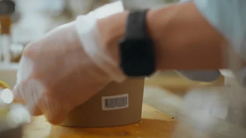 Ecologically pure. A young warehouse employee dressed in work clothes issues Stock Footage 278409542