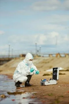 Ecologist Collecting Water Samples for Pollution Testing Stock Photos