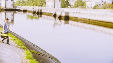 Ecologist getting samples of water in city river Stock Footage 95391776