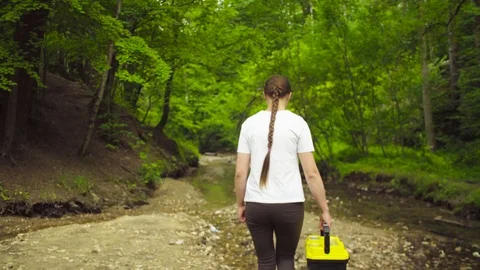 The ecologist going to the place of research. Stockbeeldmateriaal 93720747