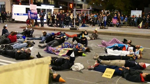 Ecologist laying on the ground for protest Stock Footage 120060397