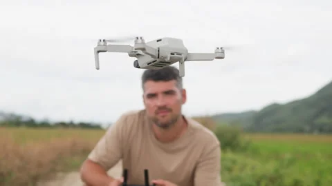 Ecologist monitors environment using drone. Quadcopter collects data on state of Video stock 322043546