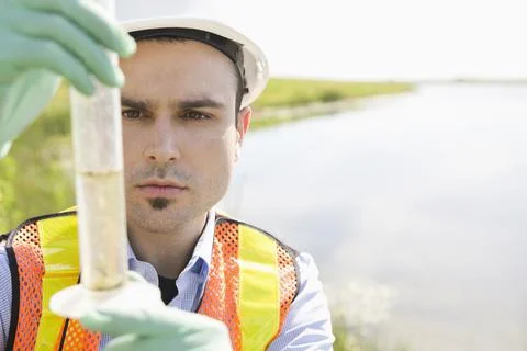 Ecologist taking water samples Foto stock