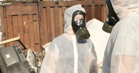 Ecologists are discussing plan for collection of hazardous samples at landfill Stock Footage 119050170