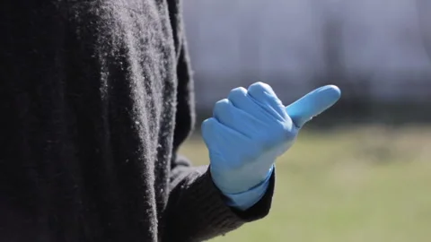 Ecologists cleaning the garbage. Man counting pollution problems by thumbs Stock Footage 113361125