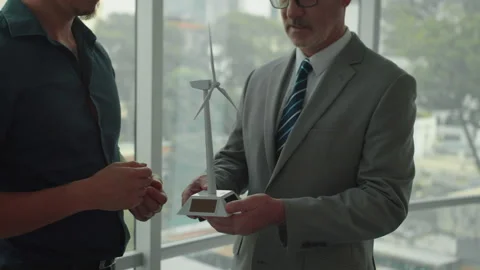 Ecologists Discussing Wind Power Implementation into Business of Client Stock Footage 276288096