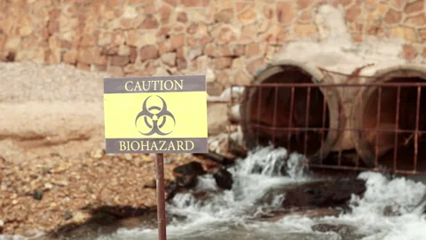 Ecologists sample water contaminated with dangerous, waterhazard toxins in tube Stock Footage 199229995