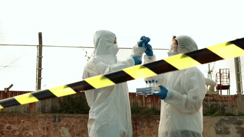 Ecologists sample water contaminated with dangerous, waterhazard toxins in tube Stock Footage 199231625