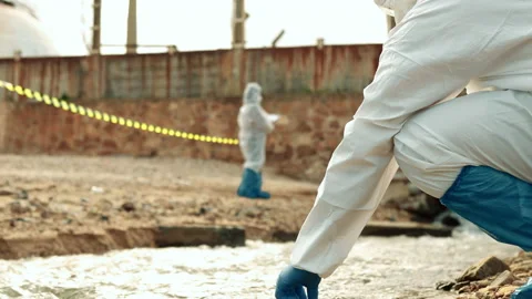 Ecologists sample water contaminated with dangerous, waterhazard toxins in tube Stock Footage 199233310