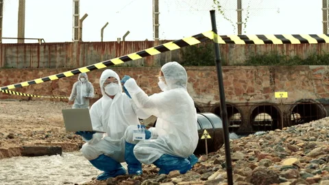 Ecologists sample water contaminated with dangerous, waterhazard toxins in tube Stock Footage 199233633