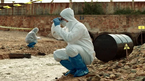 Ecologists sample water contaminated with dangerous, waterhazard toxins in tube Stock Footage 199234843