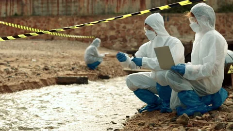 Ecologists sample water contaminated with dangerous, waterhazard toxins in tube Stock Footage 199234915