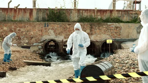 Ecologists sample water contaminated with dangerous, waterhazard toxins in tube Stock Footage 199237737