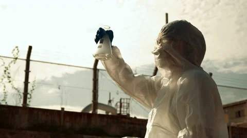 Ecologists sample water contaminated with dangerous, waterhazard toxins in tube Stock Footage 199238462
