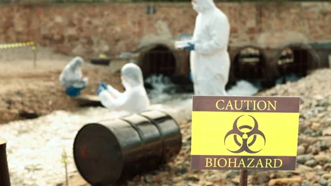 Ecologists sample water contaminated with dangerous, waterhazard toxins in tube Stock Footage 199238901