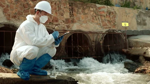 Ecologists sample water contaminated with dangerous, waterhazard toxins in tube Stock Footage 199241617