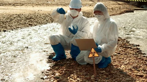 Ecologists sample water contaminated with dangerous, waterhazard toxins in tube Stock-Footage 199244560