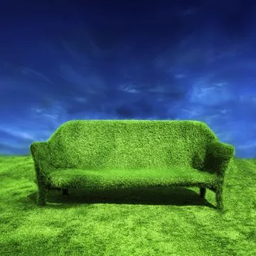 Ecology concept background. Grassy sofa standing at green grass over blue sky Stock Photos