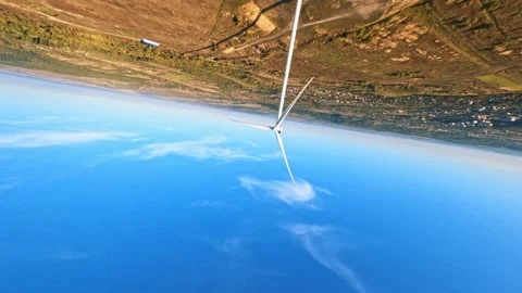 Ecology concept. FPV maneuverable flight over rural field. White large wind Stock-Footage 189416033