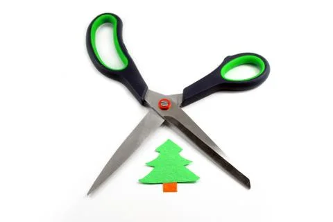 Ecology concept: paper tree being cut by scissors Stock Photos