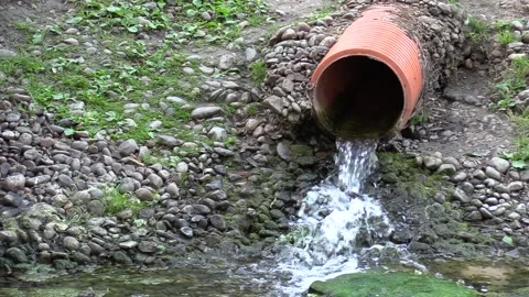 Ecology. Drain pipe to the river 스톡 동영상 135477124