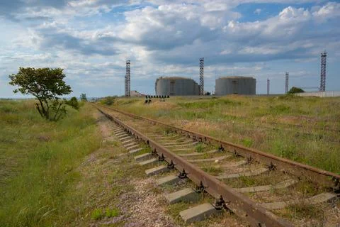 Ecology environment concept of old rusty railroad railway and oil tanks cistern Stock-Fotos