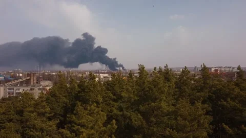 Ecology problems green forest of smoke and a fire in an industrial area Stock Footage 258406775